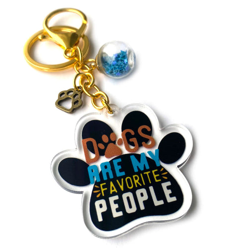Dogs Are My Favorite People keychain with acrylic paw print charm, gold clasp, blue globe and paw accent