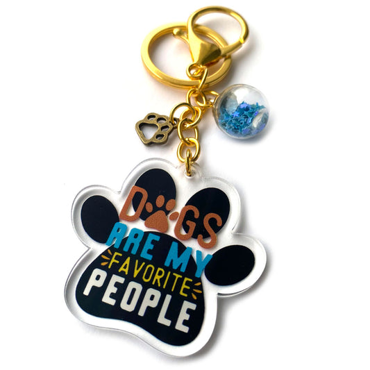 Acrylic paw-shaped keychain with motivational dog lover quote and gold clasp
