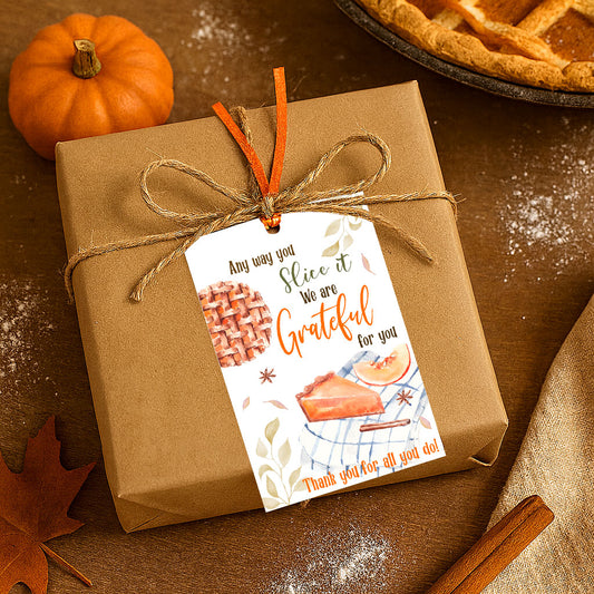 Kraft gift box tied with twine and a Pumpkin Pie Grateful For You tag, styled with pumpkin, pie, cinnamon sticks, and autumn leaves.