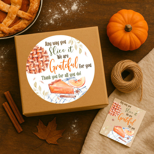 Kraft gift box styled with pumpkins, cinnamon sticks, autumn leaves, and pumpkin pie, showing placement for Thanksgiving sticker label.