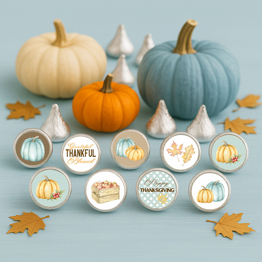 Thanksgiving candy stickers displayed with blue, cream, and orange pumpkins and scattered autumn leaves on a blue background.