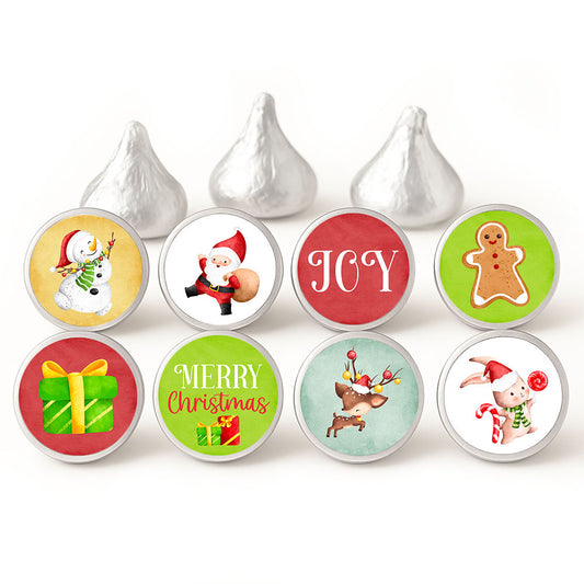 Christmas candy stickers in eight designs, including Santa, snowman, gingerbread, reindeer, gifts, Joy, and Merry Christmas, shown on silver-wrapped chocolates