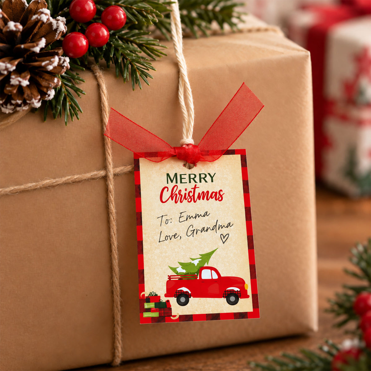 Red truck Merry Christmas gift tag tied to a kraft-wrapped present with red ribbon