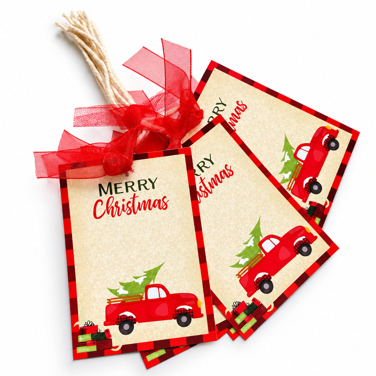Red truck Christmas gift tags spread out to show buffalo plaid borders and distressed edges