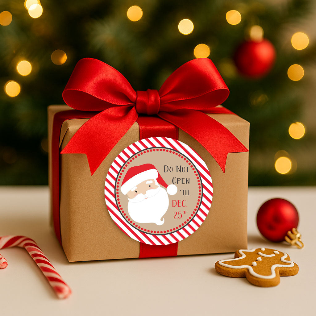 Christmas gift wrapped in kraft paper with red satin ribbon and 2 inch Santa sticker reading Do Not Open ’Til Dec. 25 – festive holiday packaging