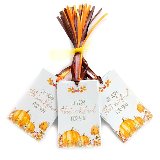 Set of 24 So Very Thankful For You favor tags with pumpkins and florals, pre-strung with brown and orange satin ribbons.