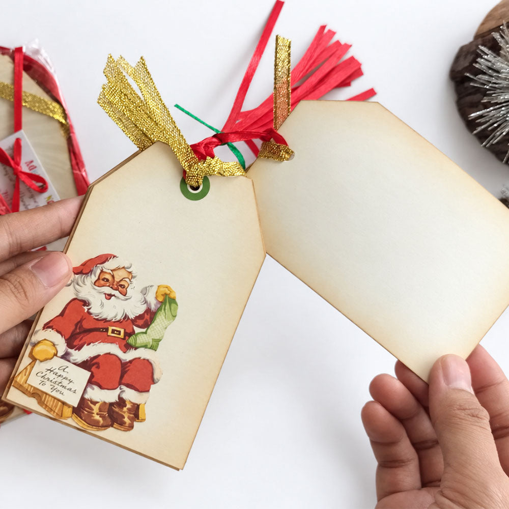 Front and blank cream back of vintage Santa Christmas gift tags, held side by side