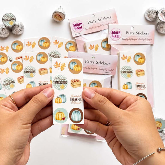 Video showing blue pumpkin Thanksgiving candy sticker sheets, packaging, and decorated chocolates.